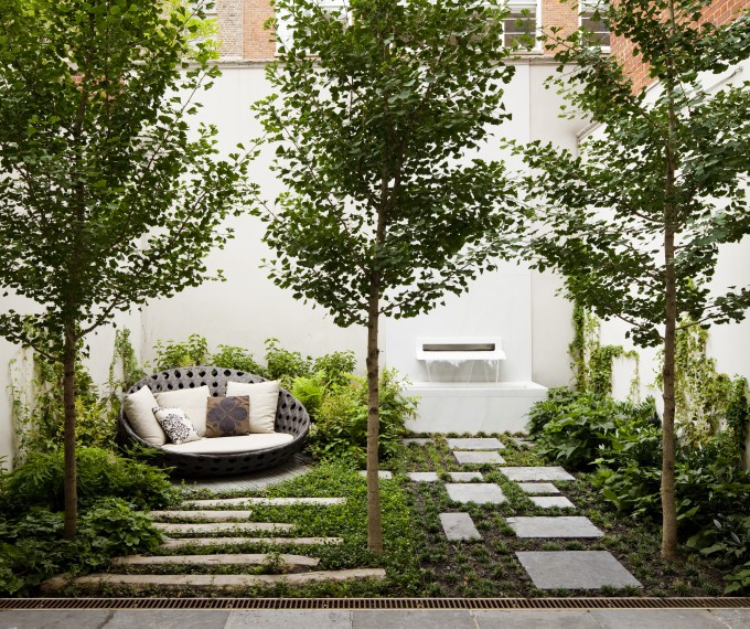 Exterior landscaping for a residence with trees and bushes, by Beneva Plantscapes